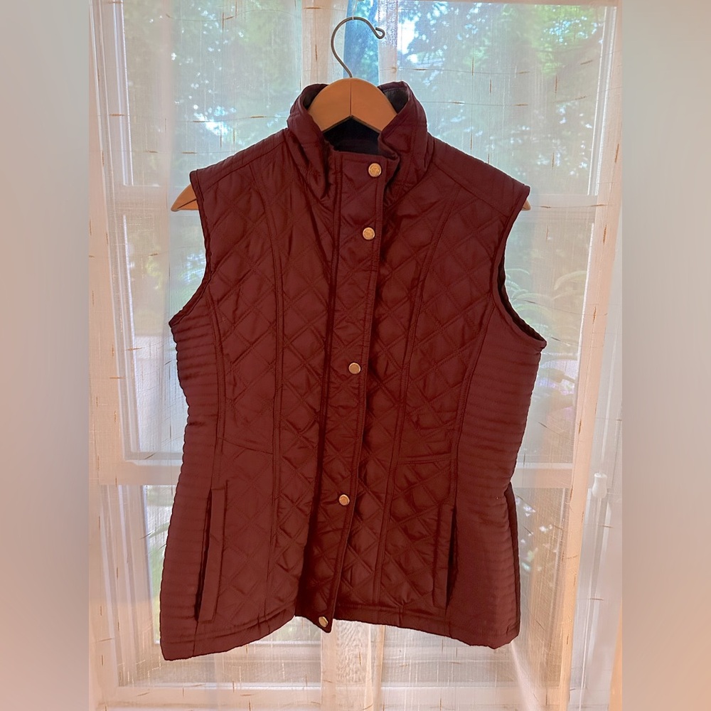 Weatherproof maroon colored vest.